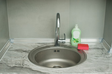 sink in the kitchen. smesitel close up.