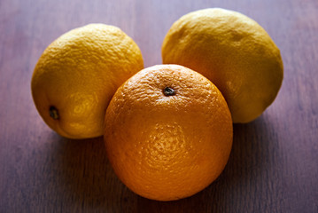 composition of lemons and oranges wooden table