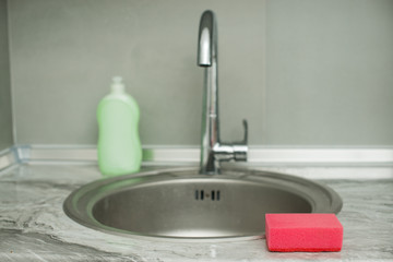 sink in the kitchen. smesitel close up.