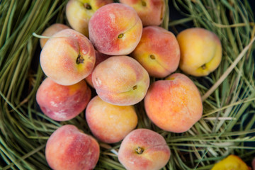 juicy peaches on the hay