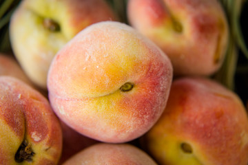 ripe orange peaches on the hay