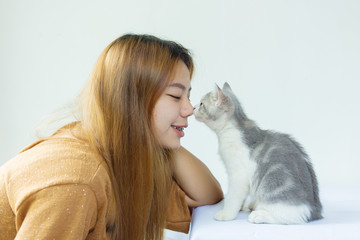 Asian women playing with cats on white background.