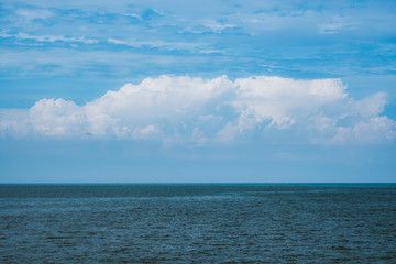 Sea and sky with big clouds