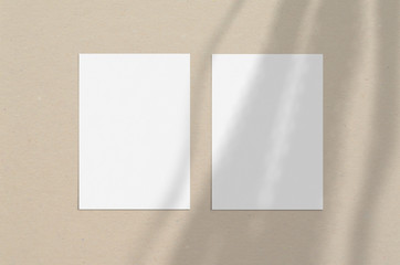 Blank white vertical paper sheet 5x7 inches with shadow overlay. Modern and stylish greeting card or wedding invitation mock up.