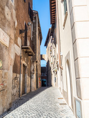 Old streets and buildings in the Gregorian Bridge ( Ponte Gregoriano ) area in Tivoli, Italy