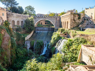 Old streets and buildings in the Gregorian Bridge ( Ponte Gregoriano ) area in Tivoli, Italy