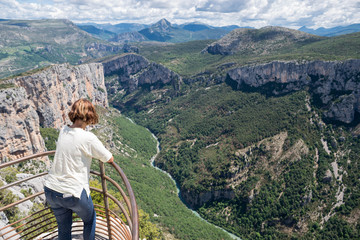 Girl looking at Gorges of Verdon canyon, South of france.