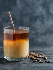 A glass of coffee with ice and cream. Cold brewed coffee