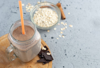 Chocolate smoothie with oatmeal and nuts in a jar