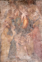 Virgin Mary with baby Jesus and Saints fresco on Palazzo Pretorio or Palazzo del Podesta in Lucca, Tuscany, Italy