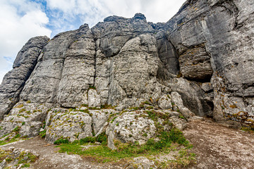 Stunning rocky limestone plateau landscape in the Burren in Caher valley, Geopark and Geosites, Wild Atlantic Way, Cloudy Spring Day in County Clare in Ireland