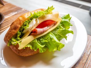 Ham sandwiches on white dish