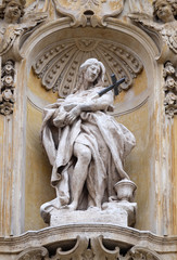 Statue of Saint Mary Magdalene on facade of Santa Maria Maddalena Church in Rome, Italy 