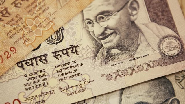 Rupee Banknotes. Smooth Pan to the Right. 4k Video