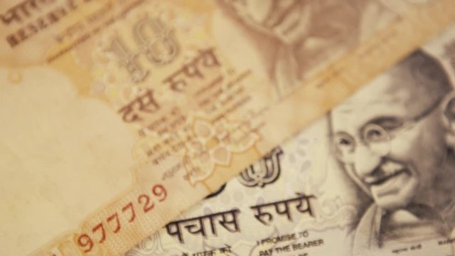 Indian currency rupee denominations of 100, 50 and 10, close up shot