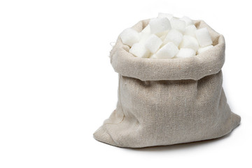 Fototapeta na wymiar Cube of cane sugar in sack bag isolated on white background.