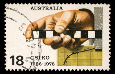 Stamp printed in AUSTRALIA shows the Survey Rule, Graph, Punched Tape, Commonwealth Scientific and...