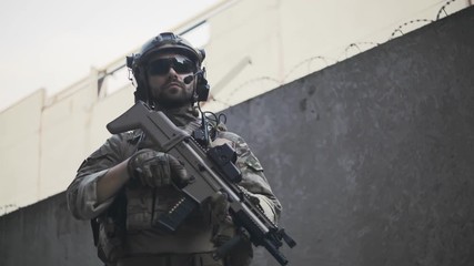 Portrait of an American soldier in the industrial zone