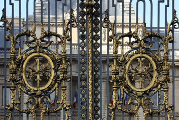 Detail of the golden gate at the justice palace in Paris