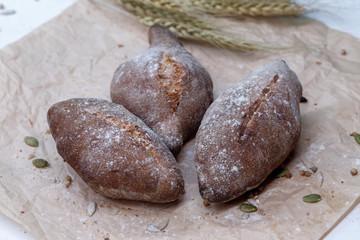 Homemade black bread, small buns of rye bread