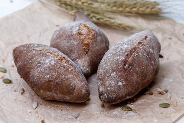 Homemade black bread, small buns of rye bread