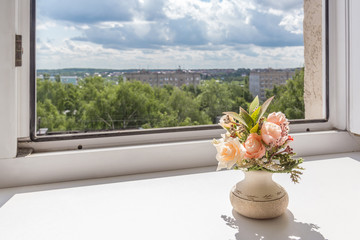 Open window and flower on the window