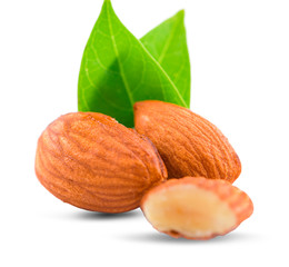 Group of almonds with leaves isolated on white background