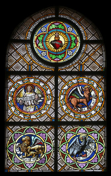 Symbols of the Evangelists, stained glass window in the parish church of St. Peter and Paul in Oberstaufen, Germany 