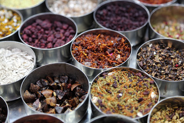 Different spices and herbs in metal bowls on a street market in Kolkata, India