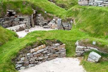 Skara Brae is a stone-built Neolithic settlement, located on the Bay of Skaill on the west coast of Mainland, the largest island in the Orkney archipelago of Scotland. Consisting of eight clustered ho