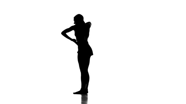 young girl dancing modern ballet,contemporary dance, black silhouette on white background,slow motion