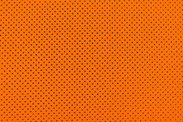 Luxury Car orange leather interior.  Part of perforated leather car seat details. Brown Perforated leather texture background. Texture, artificial leather with stitching. Perforated leather seat