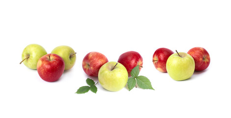 Red and green apples on a white background. Green and red apples juicy on an isolated background. A group of three apples with green leaves on a white background.