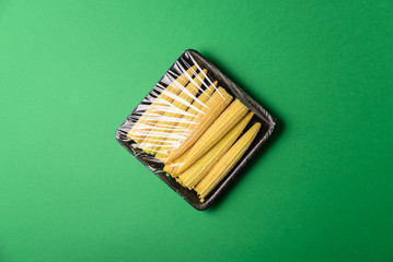 Fresh baby corn in disposable plastic package