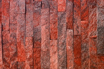nice vintage red natural quartzite stone bricks texture for use as background.