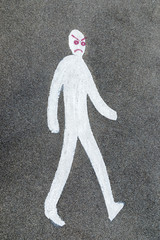 pedestrian crossing sign on asphalt