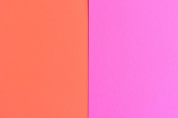 Two tone paper background with magenta and orange color. Blank colorful backdrop with empty space for image or text. Mockup concept. Neon empty paper background. Clean orange and pink wallpaper 