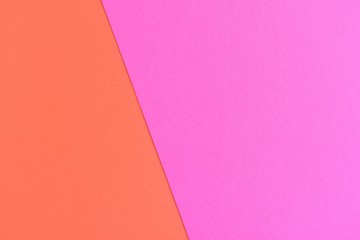 Two tone paper background with magenta and orange color. Blank colorful backdrop with empty space for image or text. Mockup concept. Neon empty paper background. Clean orange and pink wallpaper 