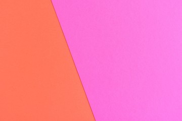 Two tone paper background with magenta and orange color. Blank colorful backdrop with empty space for image or text. Mockup concept. Neon empty paper background. Clean orange and pink wallpaper 