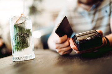Mobile payment concept. Close up of smartphone, payment terminal and credit card