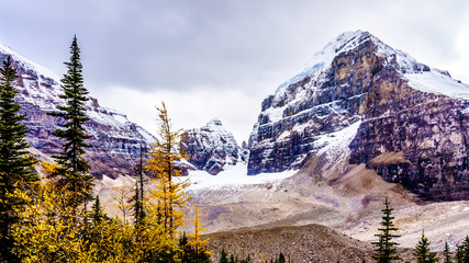 View of peaks in the Rocky Mountains at the Plain of Six Glaciers near the Victoria Glacier. Viewed from the hiking trail from the Teahouse to Plain of Six Glaciers at Lake Louise, Banff National Park