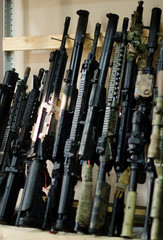 Handcrafted airsoft gun rack in the workshop worn with time