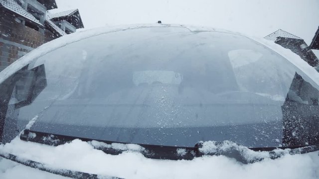 Snowing heavily on car windshield 4K