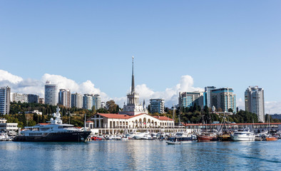 The building of the Sochi sea station and the yacht on the pier