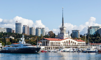 Fototapeta premium The building of the Sochi sea station and the yacht on the pier