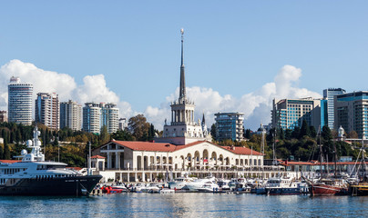 The building of the Sochi sea station and the yacht on the pier