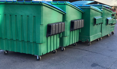 Group of Garbage Dumpsters. Photo image