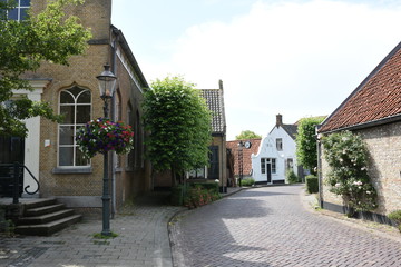Fototapeta na wymiar road with houses an church in Dutch village
