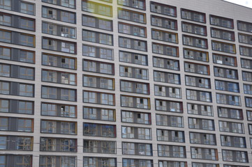 Corner of a modern residential building against the sky.