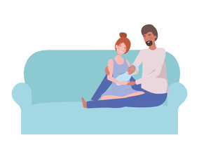 woman and man with newborn baby sitting on sofa
